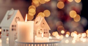 Christmas decoration on a table over blurred lights